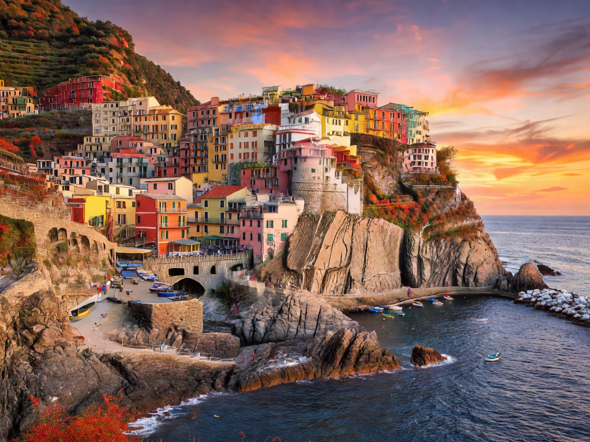 Colorful coastal village of Manarola in Cinque Terre Italy under autumn sunset